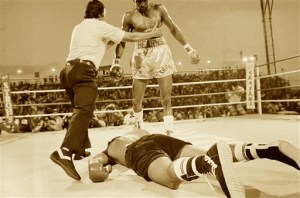 Referee Carlos Padilla pushes Thomas Hearns to a neutral corner after Hearns decked Roberto Duran during second round of their bout, June 15, 1984 in Las Vegas. Hearns won on a TKO in the WBC super welterweight championship. (AP Photo)