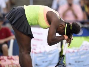 Serena Williams, of the United States, leans on her racquet as she plays Belinda Bencic, of Switzerland, during Rogers Cup semi-final tennis action in Toronto on Saturday, August 15, 2015. THE CANADIAN PRESS/Frank Gunn