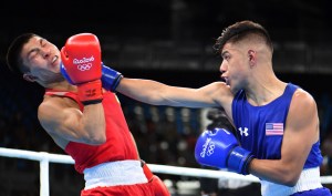 USA's Carlos Zenon Balderas Jr. (R) lands a punch on Kazakhstan's Berik Abdrakhmanov during the Men's Light (60kg) match at the Rio 2016 Olympic Games at the Riocentro - Pavilion 6 in Rio de Janeiro on August 6, 2016.   / AFP PHOTO / Yuri CORTEZYURI CORTEZ/AFP/Getty Images ORIG FILE ID: AFP_DX8O7