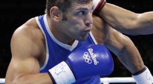 Italy's Clemente Russo, left, fights Tunisia's Hassen Chaktami during a men's heavyweight 91-kg preliminary boxing match at the 2016 Summer Olympics in Rio de Janeiro, Brazil, Monday, Aug. 8, 2016. (ANSA/AP Photo/Frank Franklin II) [CopyrightNotice: Copyright 2016 The Associated Press. All rights reserved. This material may not be published, broadcast, rewritten or redistribu]