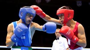 LONDON, ENGLAND - AUGUST 03: Tugstsogt Nyambayar of Mongolia (R) in action with Vincenzo Picardi of Italy during the Men's Fly (52kg) Boxing on Day 7 of the London 2012 Olympic Games at ExCeL on August 3, 2012 in London, England. (Photo by Scott Heavey/Getty Images)