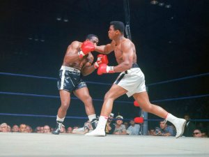 Ali and, aka Muhammad Ali (R) throwing the famous "phantom punch" during his 2nd fight vs. Sonny Liston (L)
